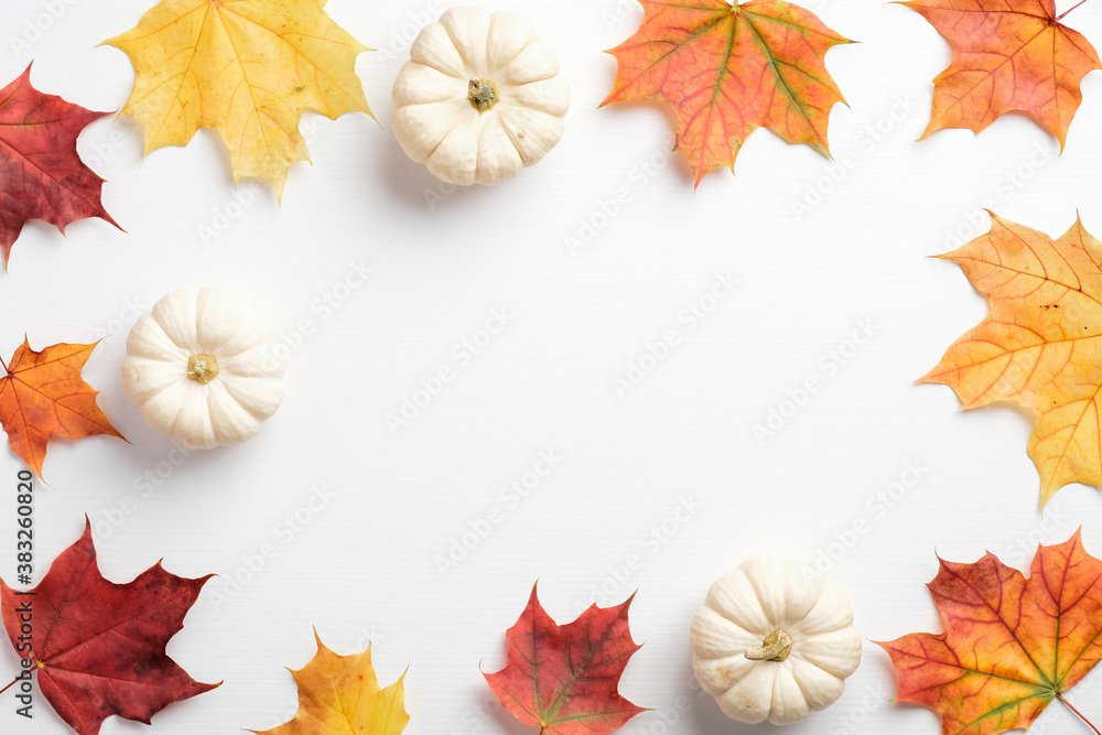 Autumn composition. Dried leaves and pumpkins on white background. Fall concept. Autumn background. Flat lay, top view, copy space Autumn composition. Dried leaves and pumpkins on white background. Fall concept. Autumn background. Flat lay, top view, copy space