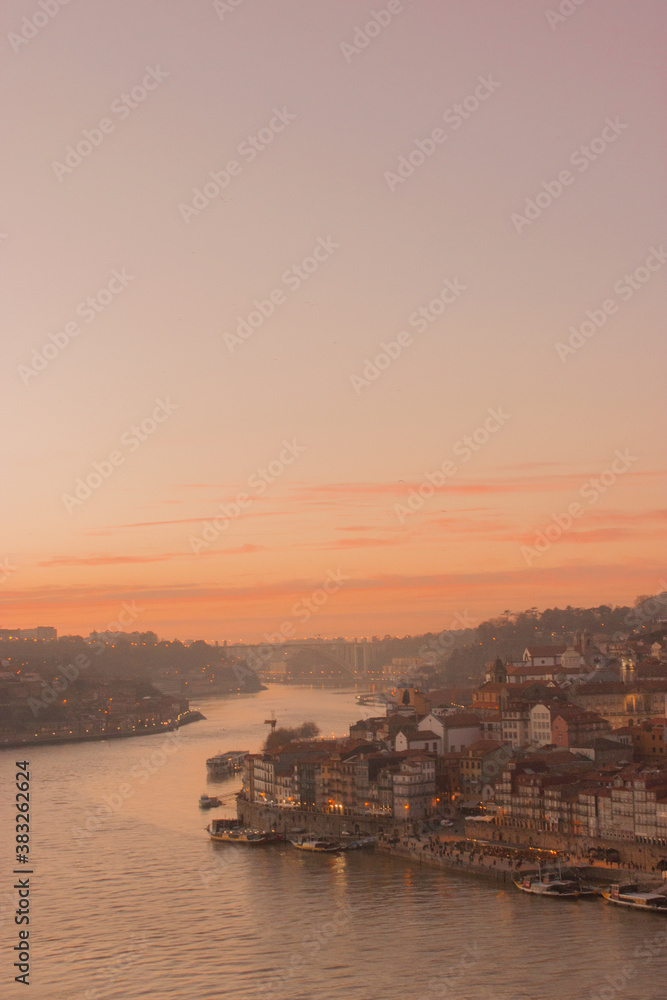 Sunset in the city of Oporto with river