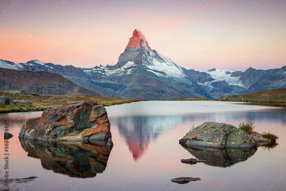 Matterhorn, Swiss Alps. Landscape image of Swiss Alps with Stellisee and Matterhorn in the background during sunrise. - obrazy, fototapety, plakaty 