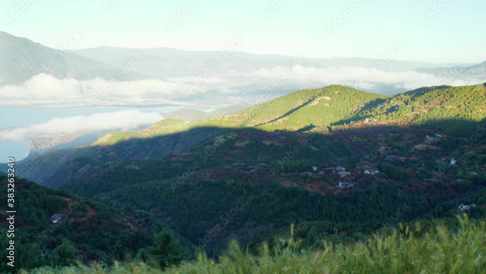Time-lapse, sunrise above the mountain, moving light and shadow Time-lapse, sunrise above the mountain, moving light and shadow