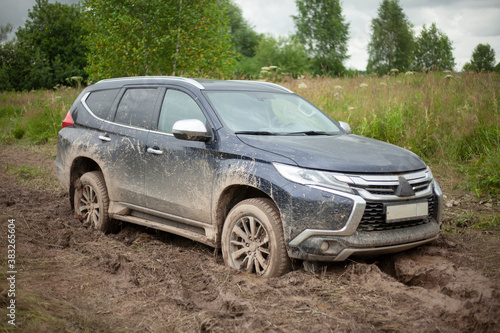 The wheels of the car are stuck in the mud. Off-road driving. © Олег Копьёв
