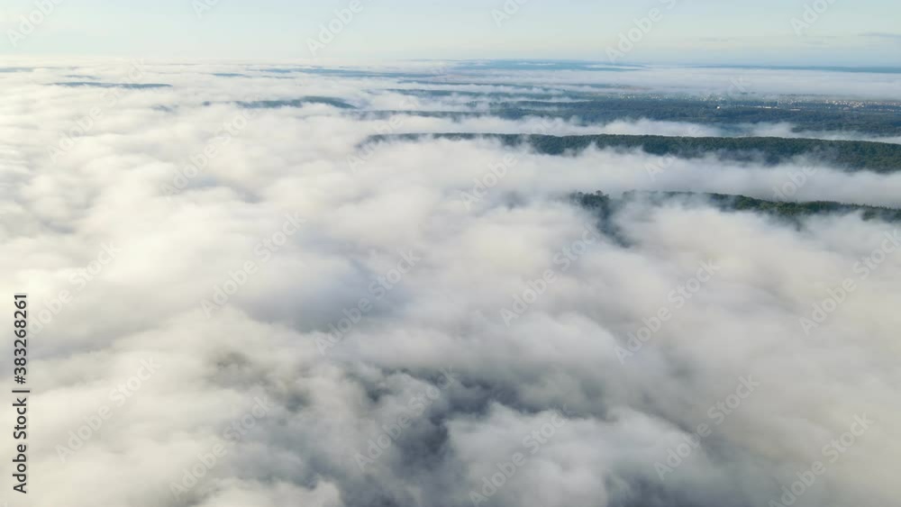 Flight over the mountains and forests covered with a magical morning mist. High flight over the fog. Flight over the mountains and forests covered with a magical morning mist. High flight over the fog.