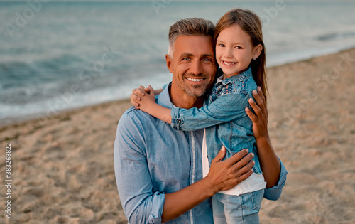 Dad with daughter on the beach © Vasyl