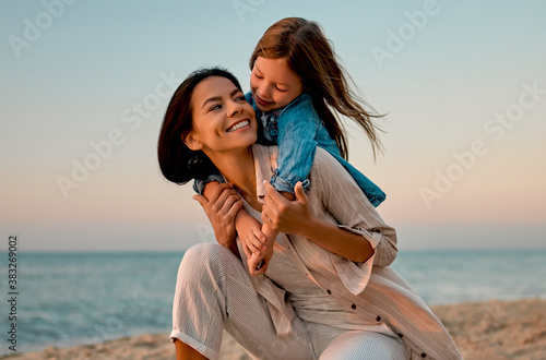 Mother with daughter on the beach