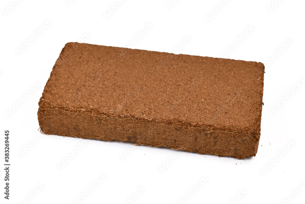Natural coconut fibre soil pressed into brick shape isolated on white background Natural coconut fibre soil pressed into brick shape isolated on white background