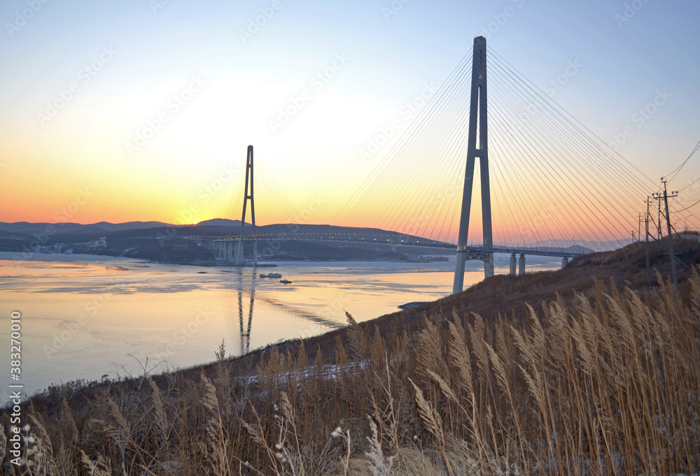 Vladivostok Bridge in the rays of the setting sun