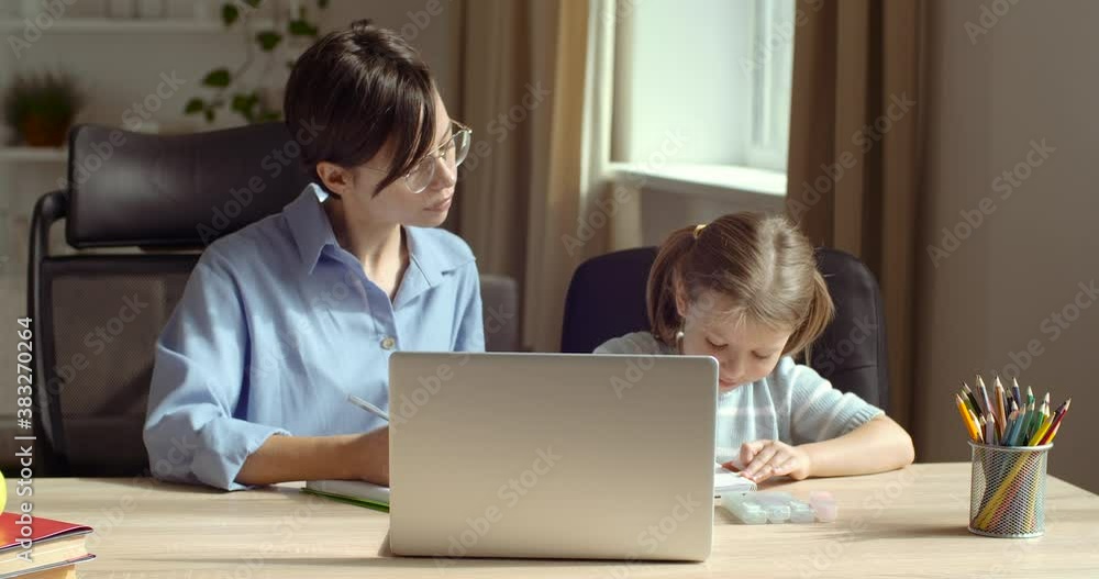 Happy family mother baby sitter teaching cute child girl playing studying at desk at home, mom helping kid daughter learning drawing coloring with pencils and markers together enjoy creative activity Happy family mother baby sitter teaching cute child girl playing studying at desk at home, mom helping kid daughter learning drawing coloring with pencils and markers together enjoy creative activity
