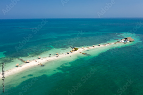 White sand beach in the carribean sea Colombia aerial view.