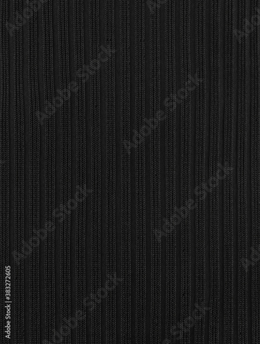 Part of black dress with stripes close up