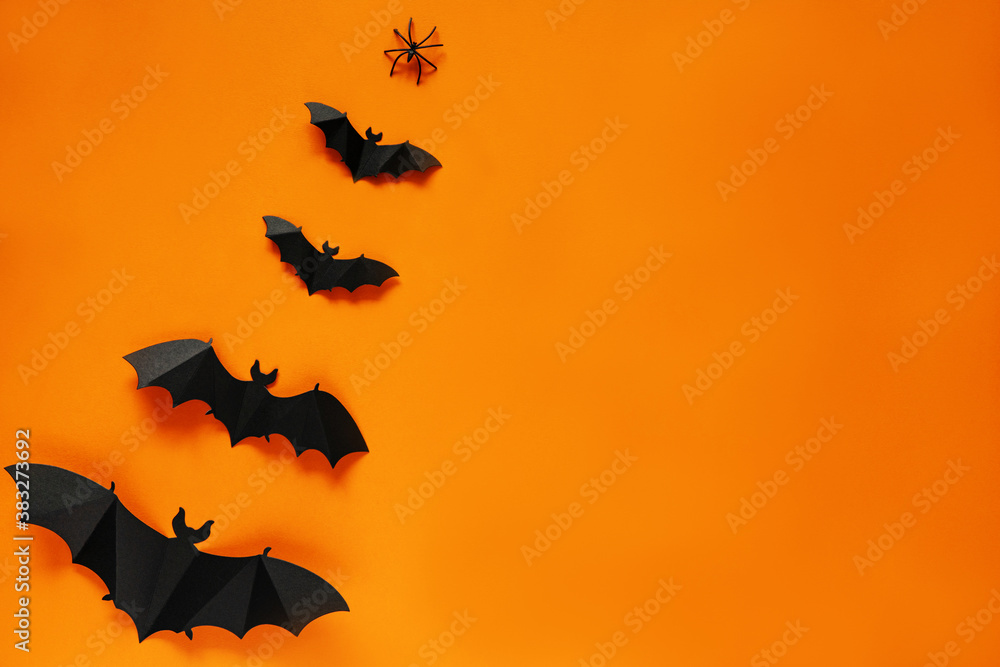 Halloween. Paper craft bats on orange background, flat layout, greeting card Halloween. Paper craft bats on orange background, flat layout, greeting card