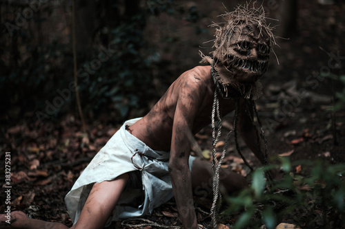 Fotografia Scary scarecrow crawling in dark forest. Halloween background