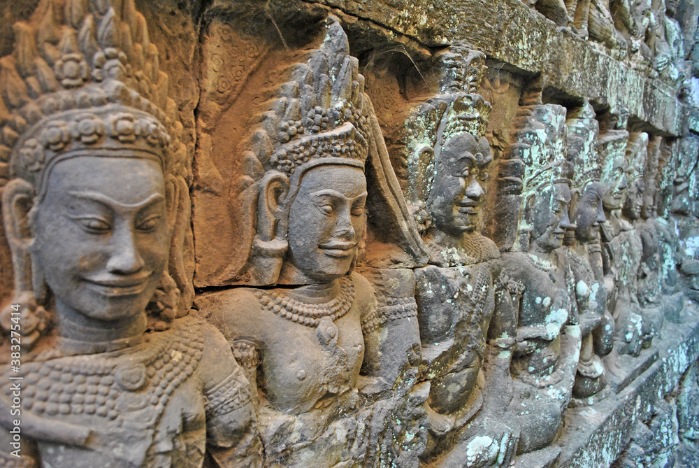 Ancient bas-reliefs at the Terrace of the Leper King in Angkor Thom