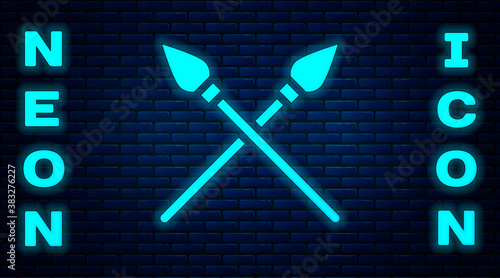 Glowing neon Crossed medieval spears icon isolated on brick wall background. Medieval weapon. Vector.