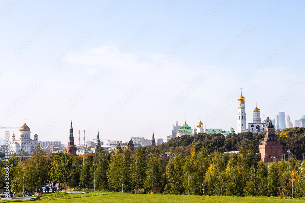 blue autumn sky over Zaryadye landscape urban public park, Kremlin and Cathedral of Christ the Saviour in Moscow city on September day blue autumn sky over Zaryadye landscape urban public park, Kremlin and Cathedral of Christ the Saviour in Moscow city on September day