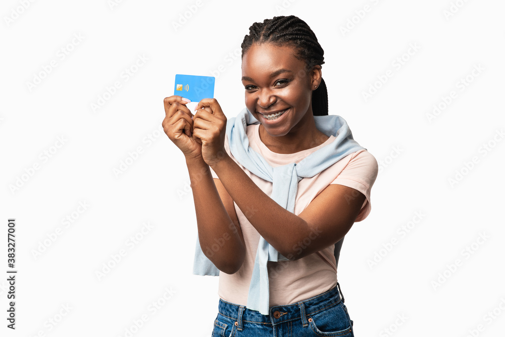 African American Woman Showing Credit Card Standing Over White Background African American Woman Showing Credit Card Standing Over White Background