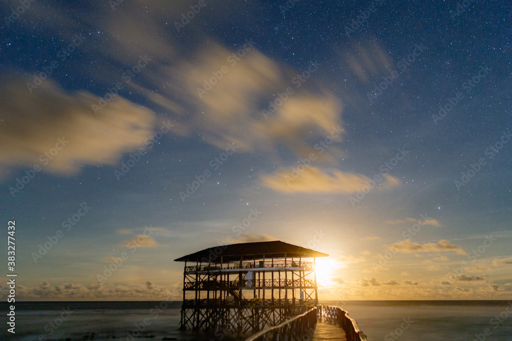 Moonrise at the Cloud 9 boardwalk and tower, Siargao island.