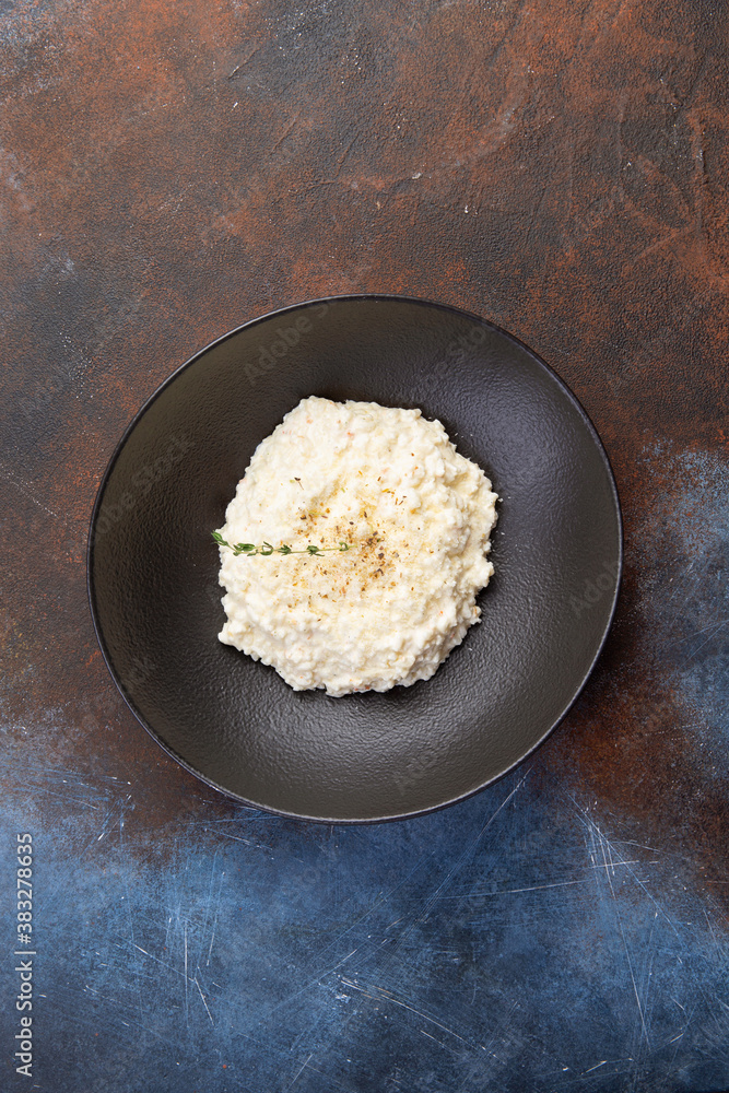 traditional Italian risotto in a dark plate traditional Italian risotto in a dark plate