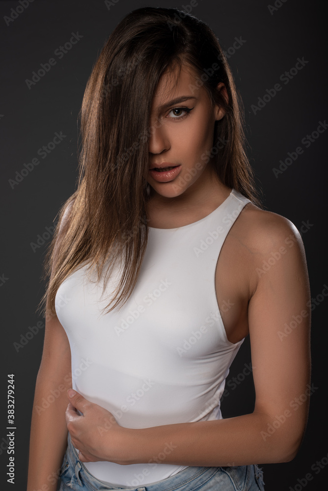 Sexy girl posing in studio on grey background. Isolated Sexy girl posing in studio on grey background. Isolated