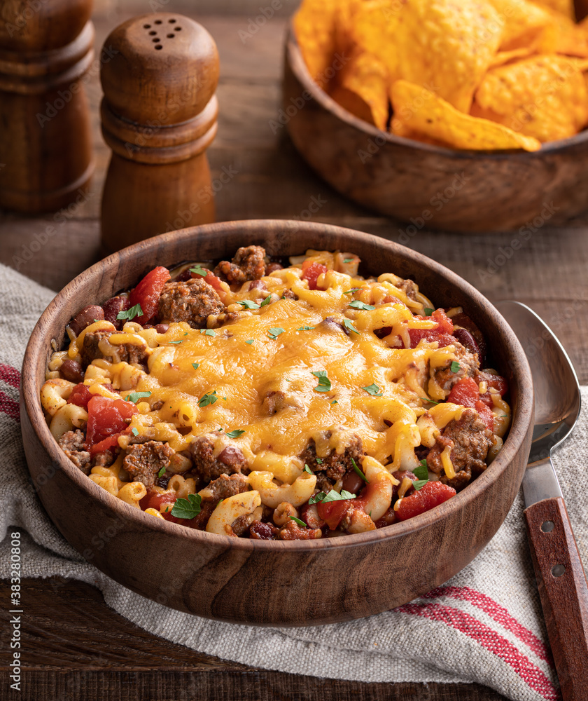 Bowl of chili mac with cheddar cheese Bowl of chili mac with cheddar cheese