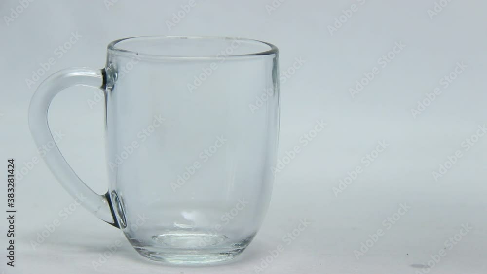 mineral water in a glass mixed with dye liquid. experiments mixing water with food coloring or cake mineral water in a glass mixed with dye liquid. experiments mixing water with food coloring or cake