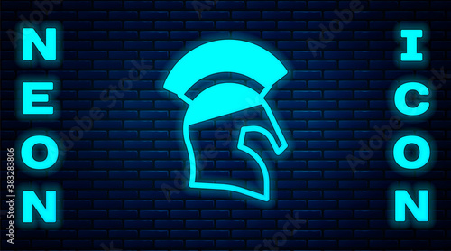 Glowing neon Greek helmet icon isolated on brick wall background. Antiques helmet for head protection soldiers with a crest of feathers or horsehair. Vector.