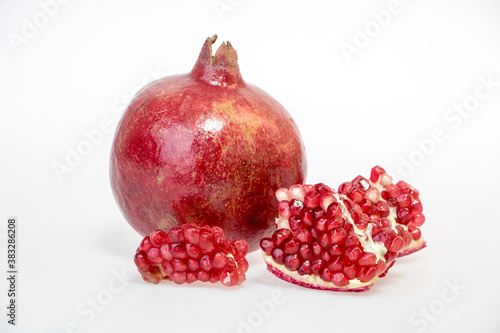 fresh and delicious pomegranate isolated on white background 