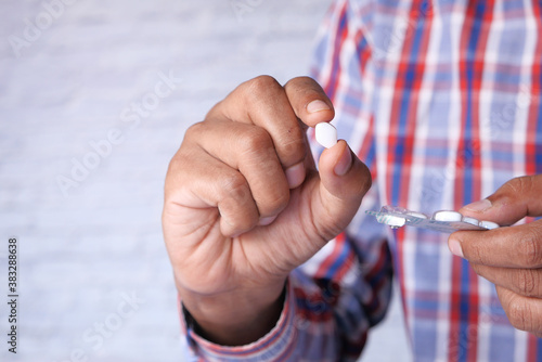 hand holding pills with copy space 