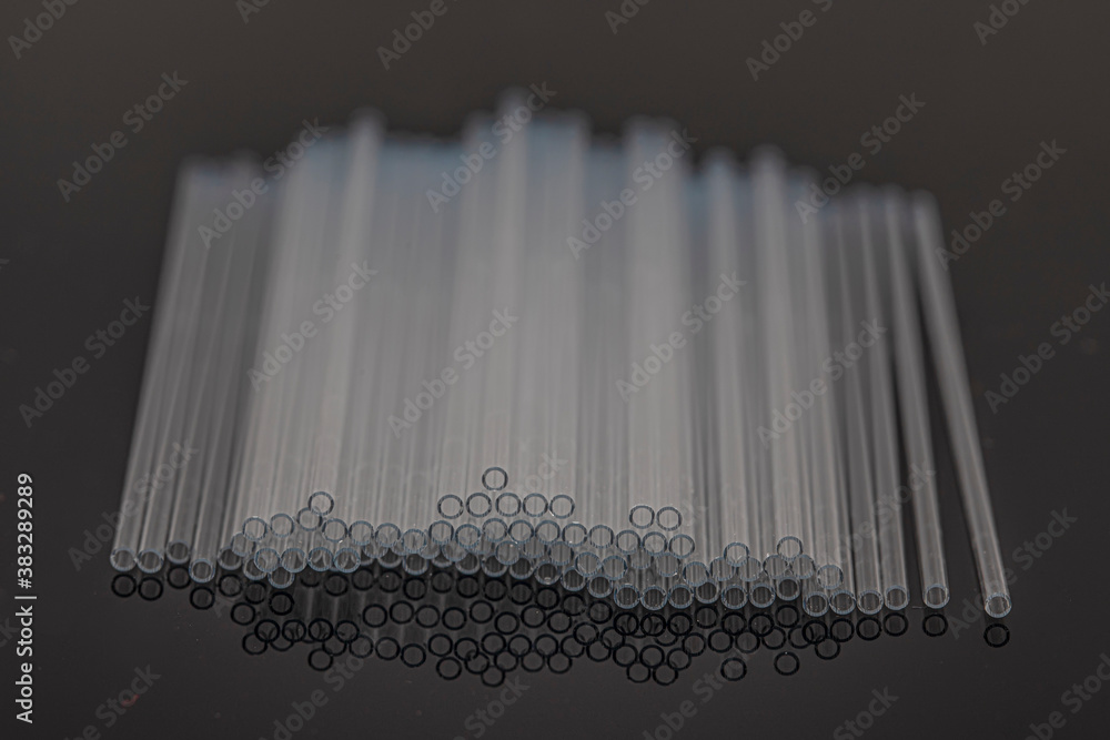 Hematocrit Capillary Tube. Medical capillary glass tubes on black background. Medical capillary
