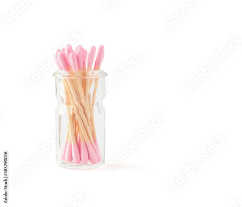 Bamboo cotton swabs in glass container isolated on white background