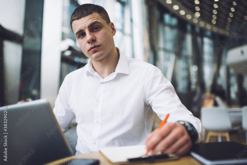 Well dressed man working on project in modern office Well dressed man working on project in modern office