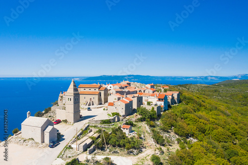 Amazing historical town of Lubenice on the high cliff, Cres island in Croatia, Adriatic sea in background