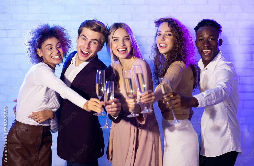 Young People Partying Toasting And Drinking Champagne Indoors Young People Partying Toasting And Drinking Champagne Indoors