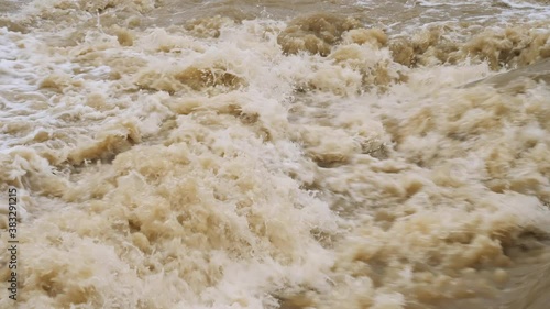 Rivers flood. Crowded river overflows its banks. Raging river with dirty water. Disaster flood deluge and water flow after rainfall.