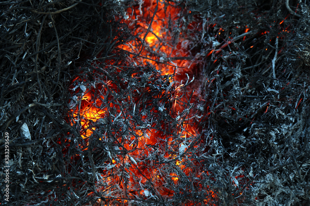 smoldering heat in a fire of grass and hay