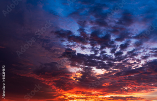 Dramatic sky clouds after sunset in the evening with colorful sunlight on twilight sky