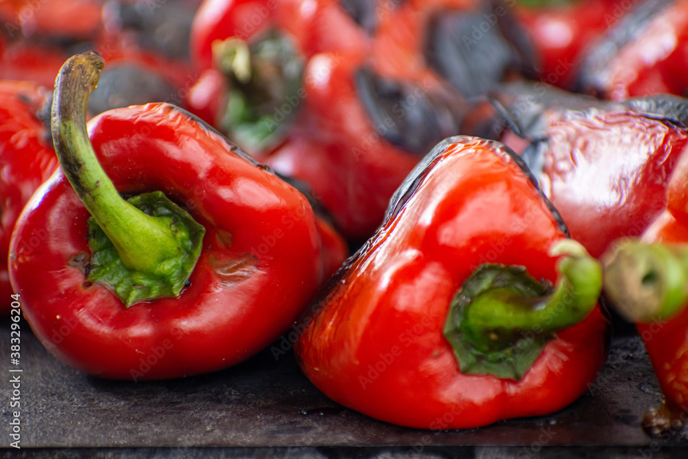 Red peppers roasting on a wood-fired stove Red peppers roasting on a wood-fired stove