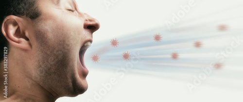 Portrait of a coughing man with coronavirus models. The spread of coronavirus infection.