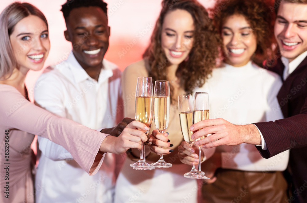 Colleagues Clinking Glasses Toasting With Champagne On Christmas Party Indoors Colleagues Clinking Glasses Toasting With Champagne On Christmas Party Indoors