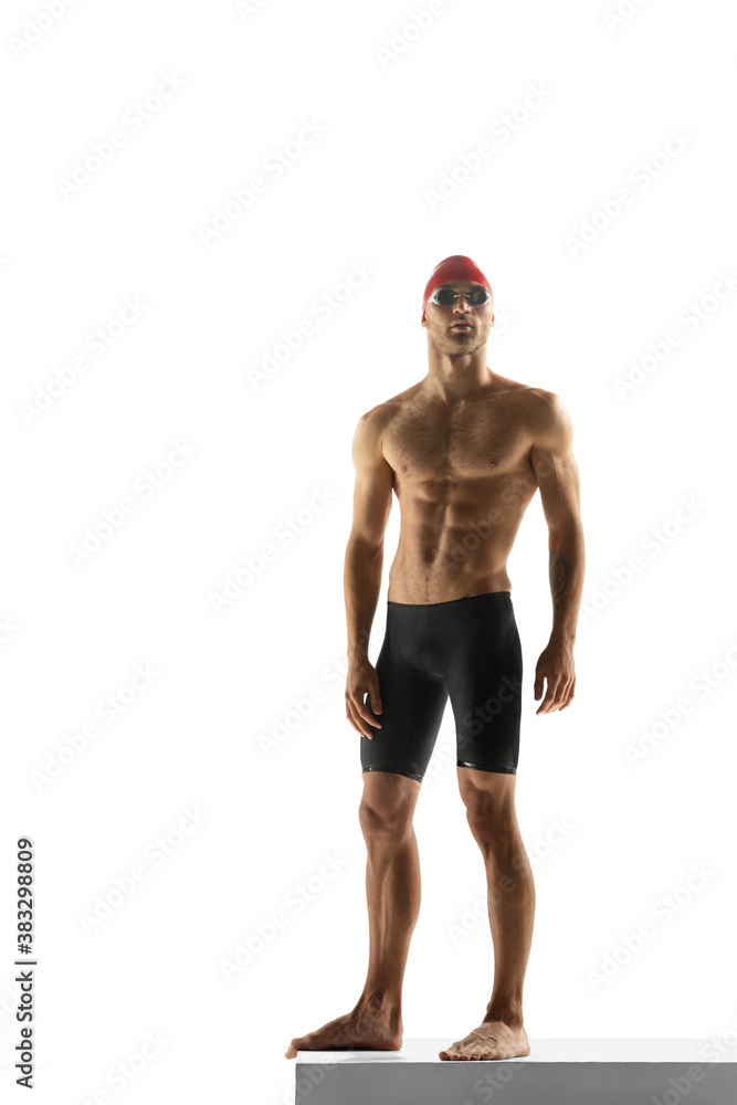 Fototapeta premium Strong. Caucasian professional sportsman, swimmer training isolated on white studio background. Muscular, sportive man practicing in water sport. Concept of action, motion, youth, healthy lifestyle.