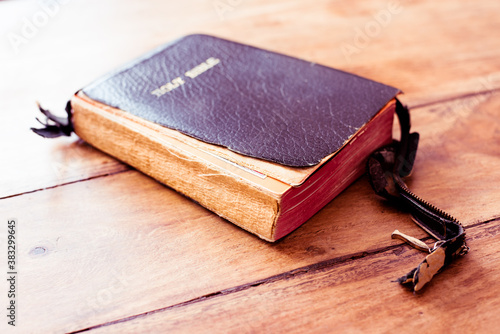 Holy Bible isolated on old vintage wooden table
