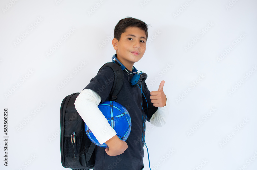 Happy schoolboy with backpack and soccer ball isolated on white background Happy schoolboy with backpack and soccer ball isolated on white background