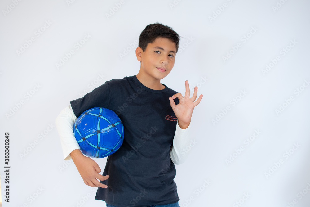 Happy schoolboy with backpack and soccer ball isolated on white background Happy schoolboy with backpack and soccer ball isolated on white background