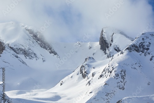 Snowy misty winter landscape in high mountains