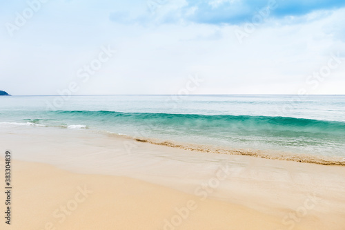Cloudy day on the peaceful beach in South of Thailand  nature and environmental concept background  monsoon season in Thailand  clean beach and clear sea water with no tourist