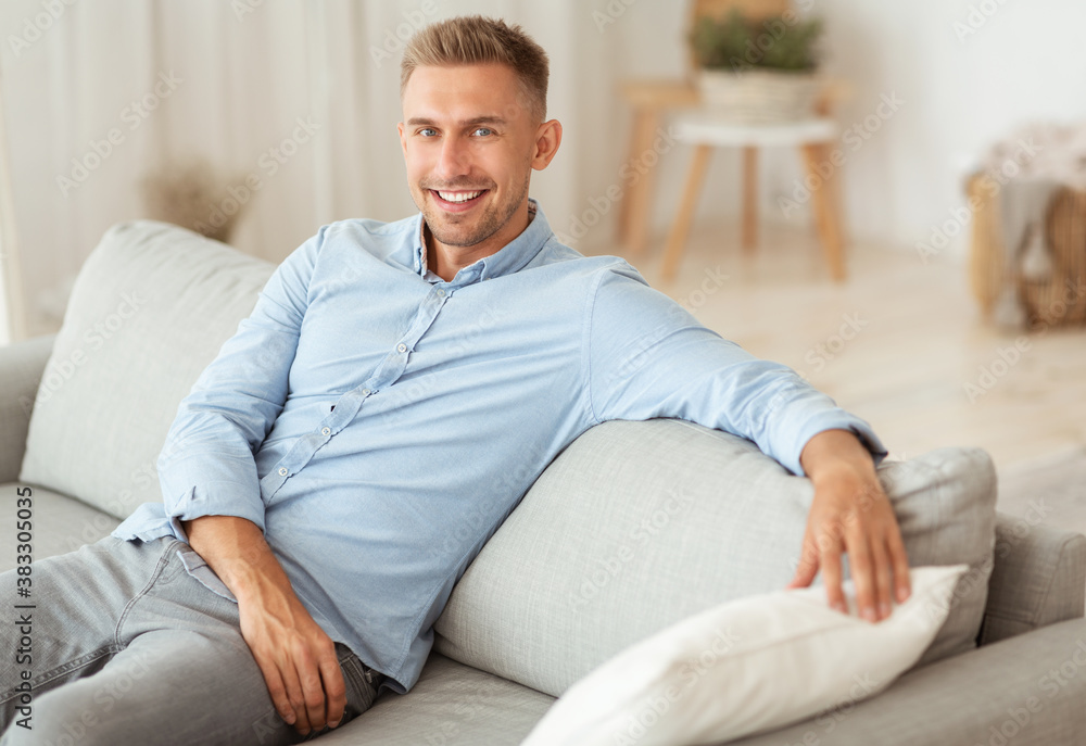 Man having rest at home on his couch Man having rest at home on his couch