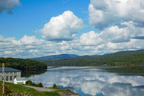 landscape with lake, mountains and clouds in autumn 
