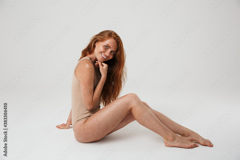 Positive pretty redhead woman with freckles Positive pretty redhead woman with freckles