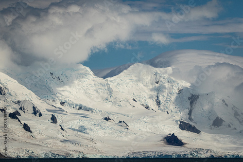 Snow covered mountains at Yankee Harbour, Antarctica photo