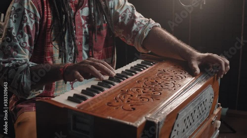 Traditional indian music concept, hindi radio, man musician playing instruments and singing song, portrait of music producer on radio, podcast streaming, culture in india, professional singer