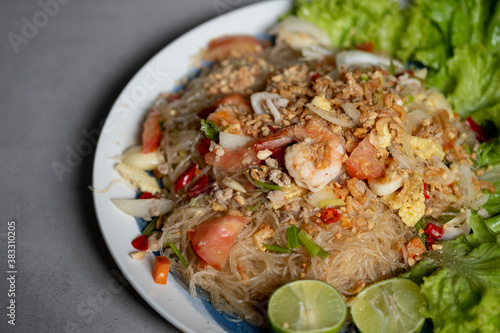 Spicy vermicelli salad with seafood, fresh vegetables.(Thai called Yum Woon Sen).